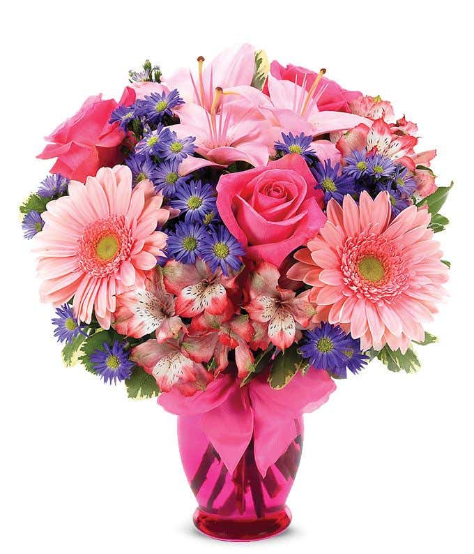 Pink Gerber daisies, pink roses and pink alstroemeria in a pink vase