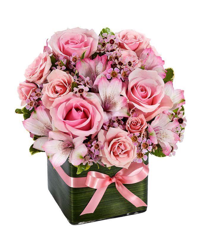 Pink roses, pink alstroemeria and pink wax flower