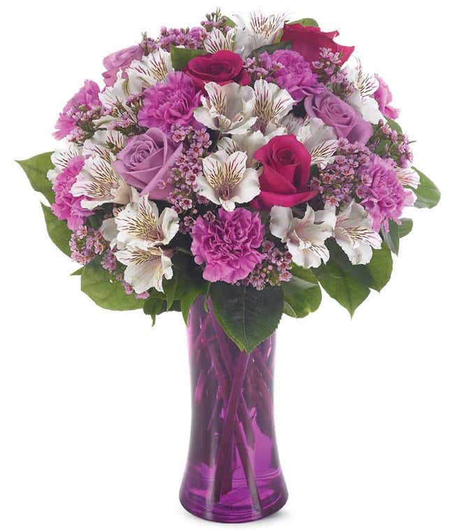 Purple roses, purple carnations and wax flower bouquet