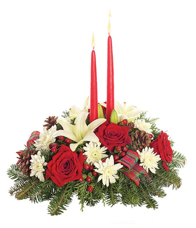 Red roses, white lilies, hypericum berries and red candle centerpieces.