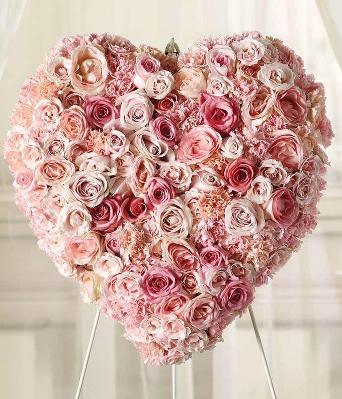 Pink roses and light pink roses in heart-shaped standing spray