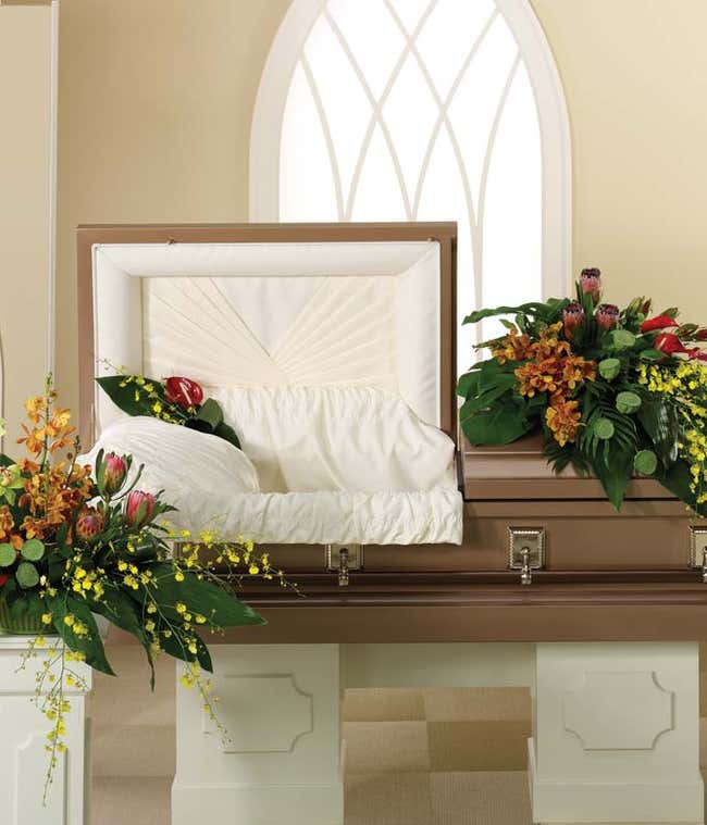 Half casket spray of red, yellow, orange &amp; green orchids