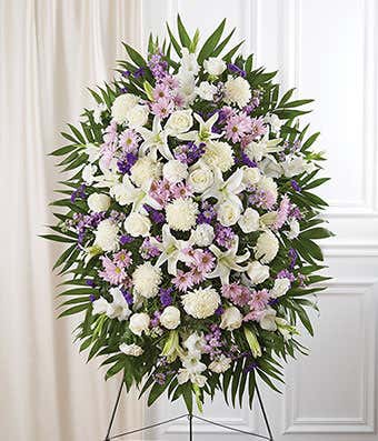 Lavender & white standing sympathy spray with roses