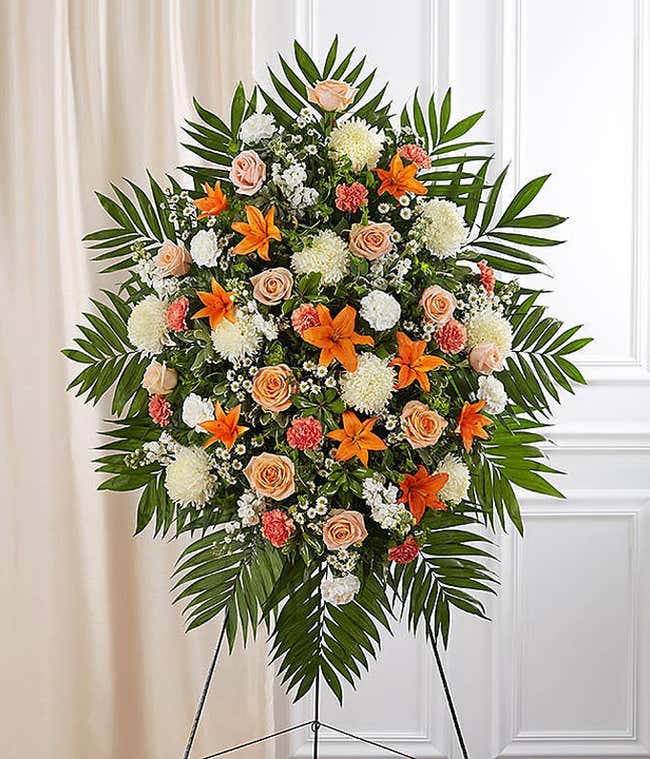 Orange roses and white spider mum funeral standing spray